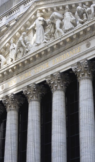 USA, New York, New York City, Manhattan  The New York Stock Exchange building in Broad Street beside Wall Street showing the main facade of the building featuring marble sculpture by John Quincy Adams Ward in the pediment called Integrity Protecting the W