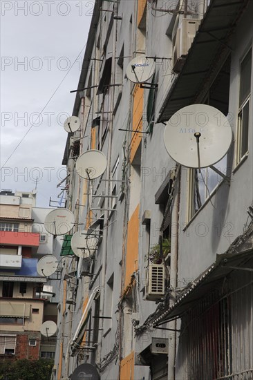 Albania, Tirane, Tirana, Satellite dishes on apartment building.