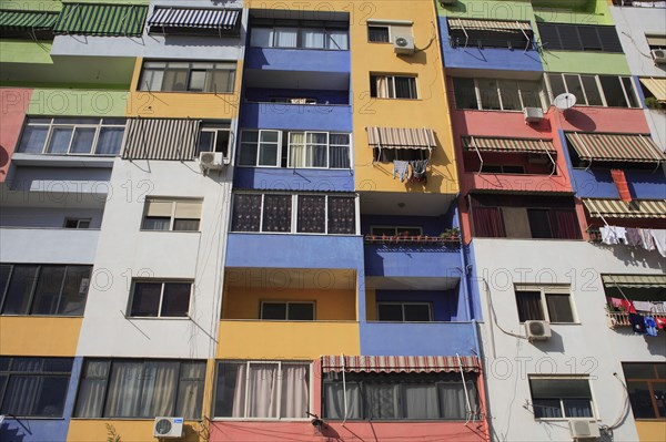 Albania, Tirane, Tirana, Multi coloured exterior facade of apartment block.