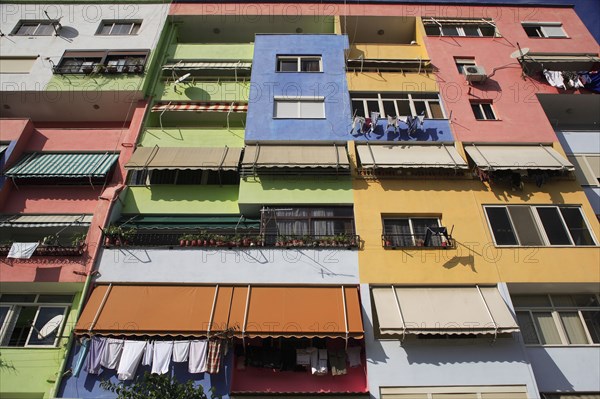 Albania, Tirane, Tirana, Multi coloured exterior facade of apartment block.