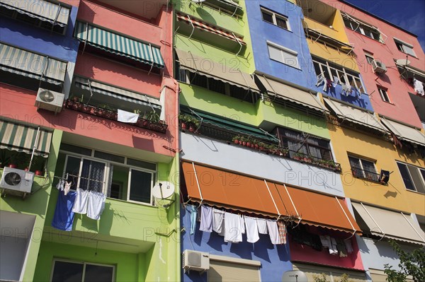 Albania, Tirane, Tirana, Multi coloured exterior facade of apartment block.