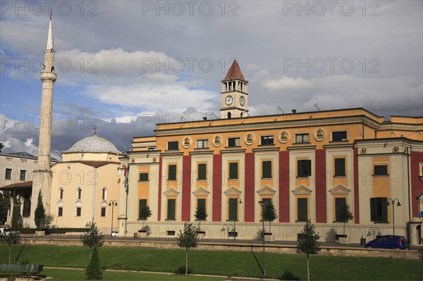 Albania, Tirane, Tirana, Government buildings and Ethem Bey mosque and minaret exterior in Skanderbeg Square.