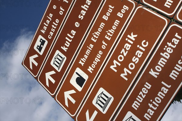 Albania, Tirane, Tirana, Street sign giving directions to places of interest.