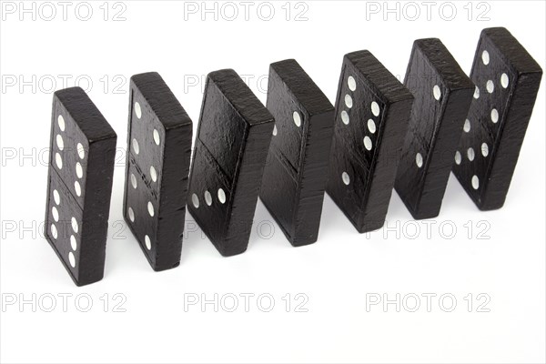 Games, Dominoes, Domino pieces standing on a white background.