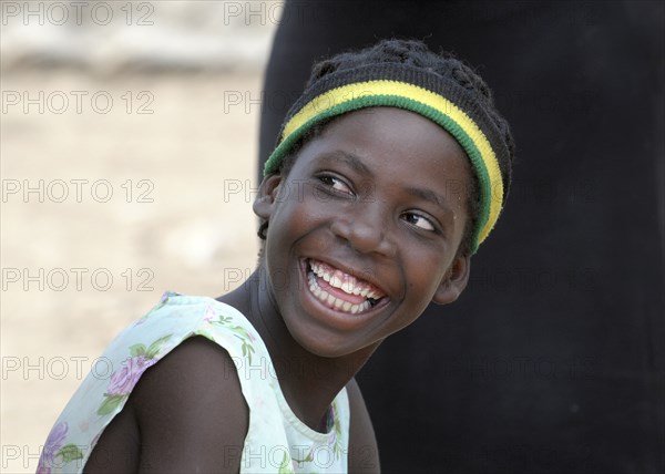 Haiti, La Gonave, Young happy smiling girl.