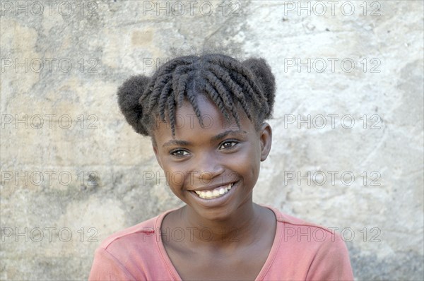 Haiti, La Gonave, Young happy smiling girl.