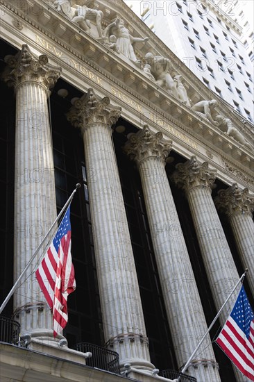 USA, New York, New York City, Manhattan  The New York Stock Exchange building in Broad Street beside Wall Street showing the main facade of the building featuring marble sculpture by John Quincy Adams Ward in the pediment called Integrity Protecting the W