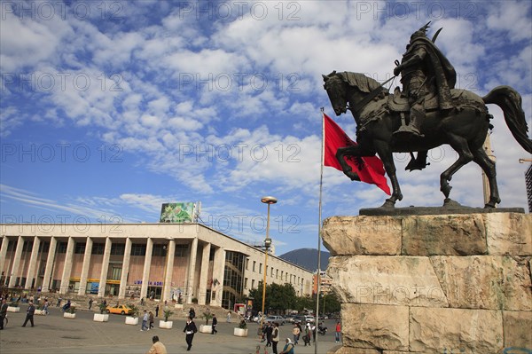 Albania, Tirane, Tirana, Equestrian statue of national hero George Castriot Skanderbeg in busy Skanderbeg Square with the Opera House in the background.