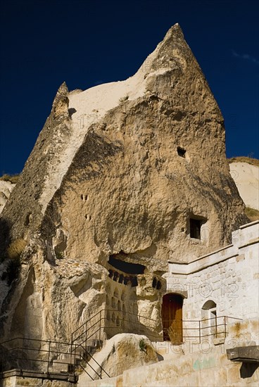 Peaked dome of cave dwelling wth visible erosion of wall. Photo: Hugh Rooney