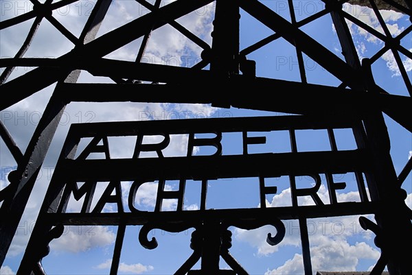 Dachau World War II Nazi Concentration Camp Memorial Site Arbeit Macht Frei slogan on gateway means Freedom through Work. Photo: Hugh Rooney