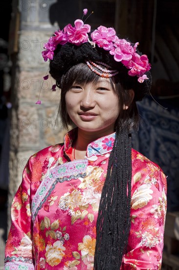 Mosuo girl wearing a colourful costume. Photo : Mel Longhurst