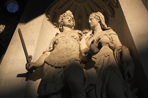 Cropped view of statues partly in shadow in the courtyard of the Hofburg Palace. Photo: Bennett Dean