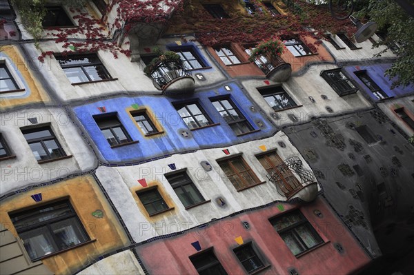 The Hundertwasser-Krawinahaus angled part view of exterior facade of apartment building. Photo: Bennett Dean