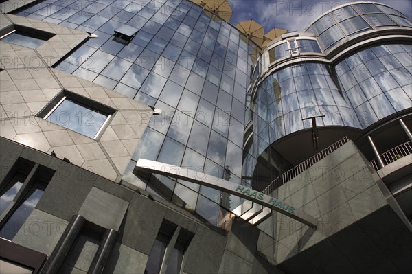 Exterior detail of the Haas Building or Haas Haus. Modern glass fronted and concrete office building in Saint Stephens Square. Photo: Bennett Dean