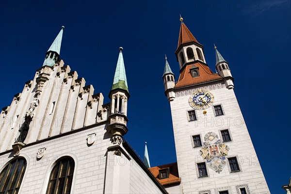 Marienplatz. Altes Rathaus or Old Town Hall. Original building dating from the fifteenth century with baroque facade added in the seventeenth century. Angled detail of facade and clock tower. Photo: Hugh Rooney