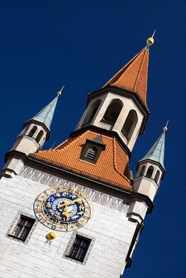 Marienplatz. Altes Rathaus or Old Town Hall. Original building dating from the fifteenth century with baroque facade added in the seventeenth century. Angled detail of clock tower. Photo : Hugh Rooney