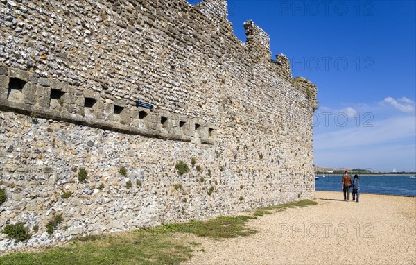 Portchester Castle Norman 12th Century flint walls with the garderobe chutes or toilets from the old Augustine priory. Photo : Paul Seheult