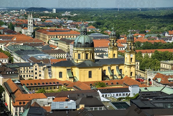 City rooftops with dome of Theatinerkirche St Kajetans Church at centre and Hofgarten on right. View from tower of Frauenkirche ninety-eight metres to the south.. Photo: Hugh Rooney