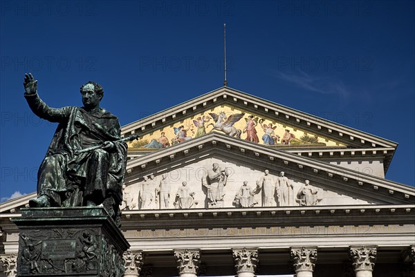 Residenz the Former Royal Palace of Bavarian rulers from 1385 - 1918. Part view of carved and decorated portico with statue of Emperor Maximilian Joseph in foreground. Photo : Hugh Rooney