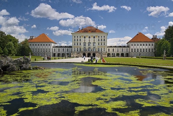 Nymphenburg Palace. Baroque exterior facade set in formal gardens with lake in foreground. Photo : Hugh Rooney