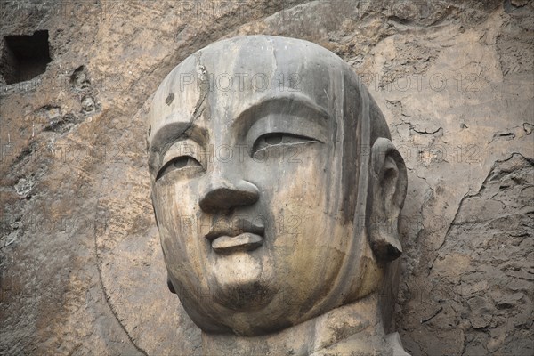 Carved Buddha statue in the Fengxian Temple Tang Dynasty Longmen Grottoes and Cave. Photo: Mel Longhurst