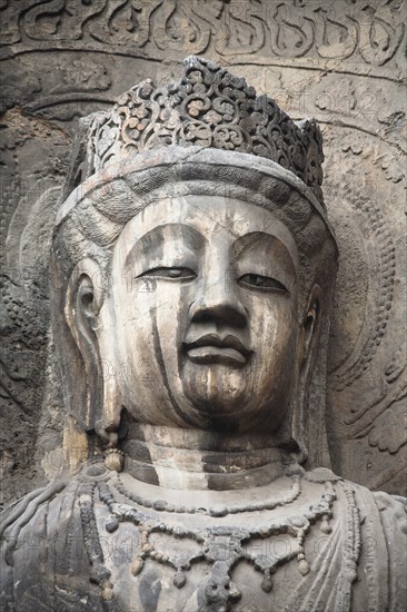 Carved Buddha statue in the Fengxian Temple Tang Dynasty Longmen Grottoes and Cave. Photo: Mel Longhurst