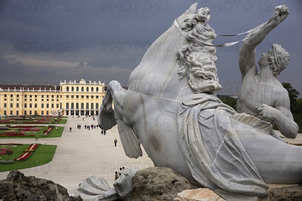Detail from the Neptune Fountain with the Schonnbrunn Palace in the background. Photo : Bennett Dean