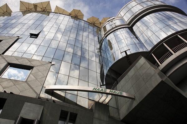 Exterior detail of the Haas Building or Haas Haus. Modern glass fronted and concrete office building in Saint Stephens Square. Photo : Bennett Dean