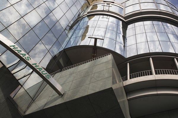 Exterior detail of the Haas Building or Haas Haus. Modern glass fronted and concrete office building in Saint Stephens Square. Photo : Bennett Dean