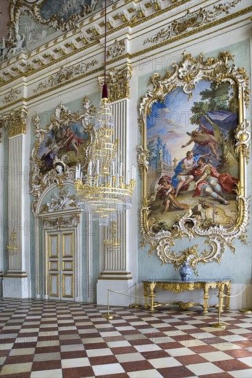 Nymphenburg Palace. Interior of Steinerner Saal the Stone or Great Hall with detail of paintings red and white chequered floor and gold and white baroque decoration by Francois de Cuvillies. Photo : Hugh Rooney