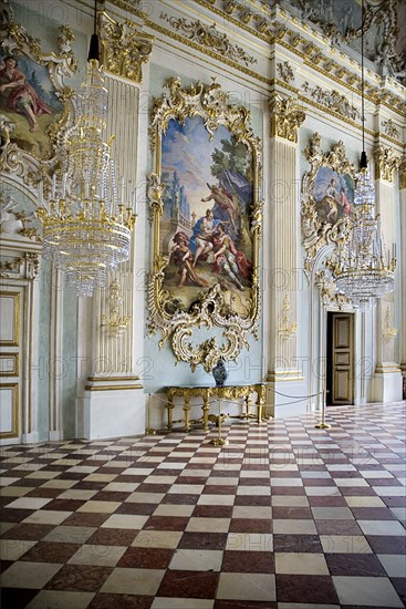 Nymphenburg Palace. Interior of Steinerner Saal the Stone or Great Hall with detail of paintings red and white chequered floor and gold and white baroque decoration by Francois de Cuvillies. Photo : Hugh Rooney
