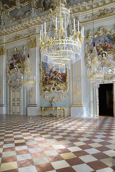 Nymphenburg Palace. Interior of Steinerner Saal the Stone or Great Hall with detail of paintings red and white chequered floor and gold and white baroque decoration by Francois de Cuvillies. Photo : Hugh Rooney