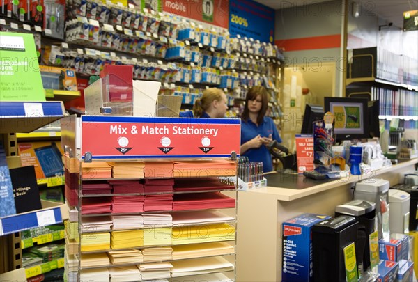 Rymans office staionery store with two female shop assistants behind counter. Photo : Paul Seheult