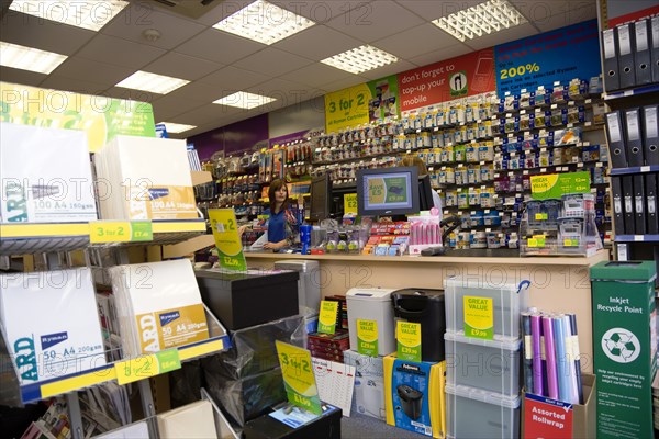 Rymans office staionery store with two female shop assistants behind counter. Photo : Paul Seheult