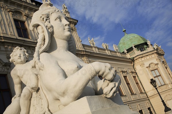 Angled view of sphinx statue outside Belvedere Palace part seen behind. Photo: Bennett Dean