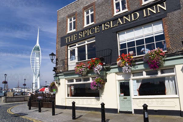 The 170 metre tall Spinnaker Tower and Historic Naval Dockyard seen from Spice Island in Old Portsmouth with The Spice Island Inn in the foreground. Photo : Paul Seheult