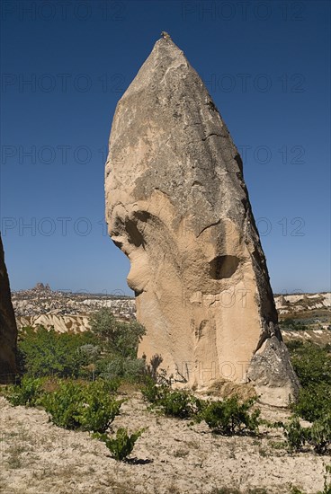 Sword Valley rock formation with hilltop town of Uchisar in distance behind. The valley got its name because of the appearance of sharpness of the rock pinnacles found there.. Photo : Hugh Rooney