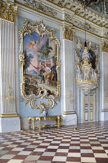 Nymphenburg Palace. Interior of Steinerner Saal the Stone or Great Hall with detail of paintings red and white chequered floor and gold and white baroque decoration by Francois de Cuvillies. Photo: Hugh Rooney