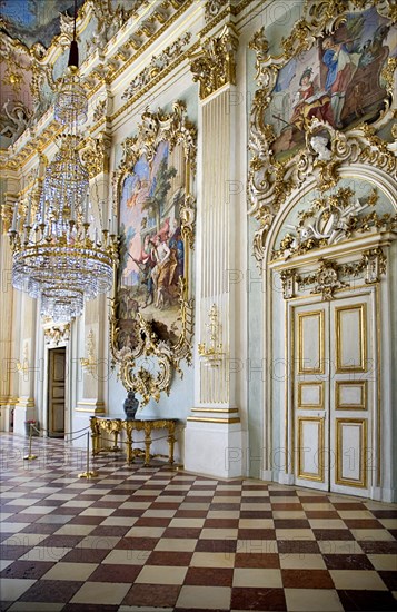 Nymphenburg Palace. Interior of Steinerner Saal the Stone or Great Hall with detail of paintings red and white chequered floor and gold and white baroque decoration by Francois de Cuvillies. Photo: Hugh Rooney