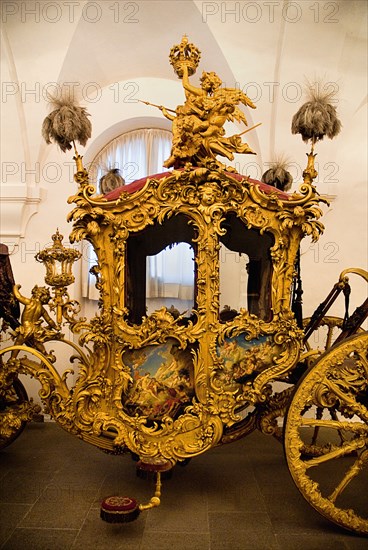 Nymphenburg Palace Marstall Museum. Highly ornate gold and painted coach made for the coronation of King Max I Joseph in 1818. Photo : Hugh Rooney