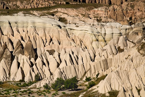 View across Rose Valley in foreground towards Red Valley behind with jagged eroded peaks of volcanic tufa rock formations. Photo: Hugh Rooney