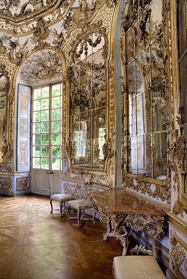 Nymphenburg Palace. Amalienburg The Hall of Mirrors. Hunting lodge created for Electress Amalia in European Rococo style. Highly ornate white and gold interior with mirrored walls. Photo: Hugh Rooney