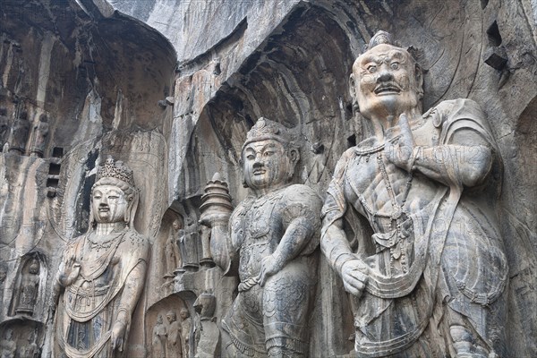 Carved Buddhist statues Fengxian Temple Tang Dynasty Longmen Grottoes and Caves. Photo: Mel Longhurst