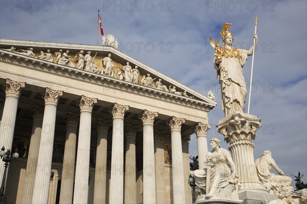 Statue of Athena set on pillar rising above fountain in front of Parliament building. Photo: Bennett Dean