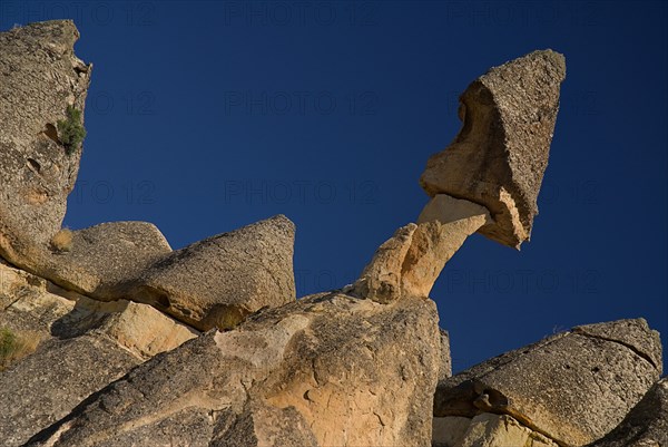 Pasabag. Angled view of fairy chimney with rock perched on top in gravity defying position. Photo : Hugh Rooney