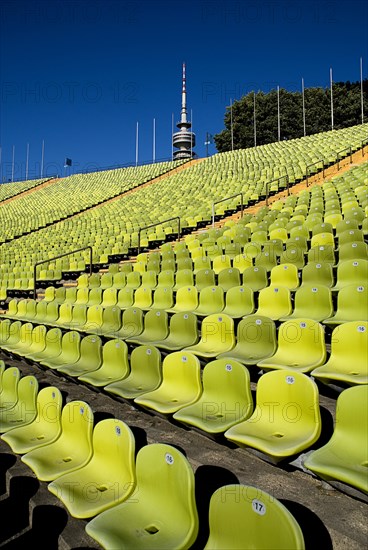 Olympic Stadium. View across green seating of the stadium with part view of the Olympic Tower behind. Photo : Hugh Rooney