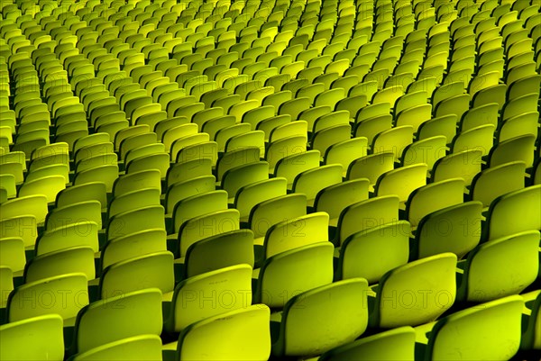 Olympic Stadium. Curved section of bright green seating in the stadium. Photo : Hugh Rooney