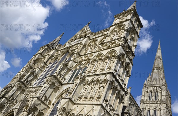 The West Front main entrance of the 13th Century Early English Gothic Cathedral Church of the Blessed Virgin Mary with the tallest spire in Britain. The statues conform to a carefully considered iconography based on the Te Deum with bishops and doctors s. Photo: Paul Seheult