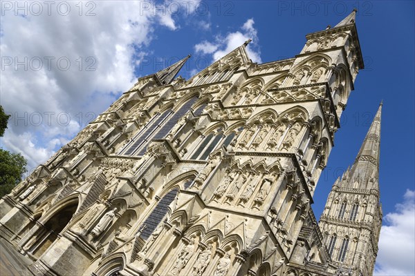 The West Front main entrance of the 13th Century Early English Gothic Cathedral Church of the Blessed Virgin Mary with the tallest spire in Britain. The statues conform to a carefully considered iconography based on the Te Deum with bishops and doctors s. Photo: Paul Seheult