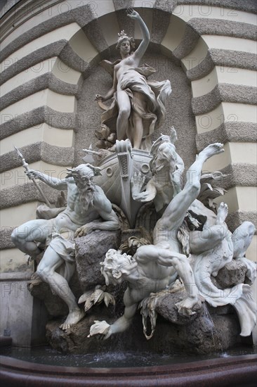 Michaelertrakt the southern gateway into the Hofburg Palace. The statues and figures include Heracles the greatest of the Greek heroes and represent Austrias power over land and sea. Photo : Bennett Dean